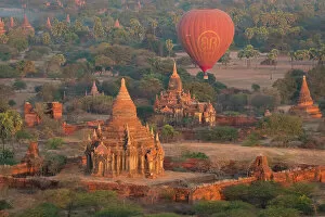 Tourist Attractions Gallery: Old temple in Bagan and hot-air balloons before sunrise, Old Bagan (Pagan)
