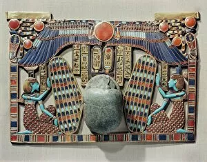 Tutankhamun Collection: Pectoral decorated with winged scarab, protected by the goddesses Isis and Nephthys