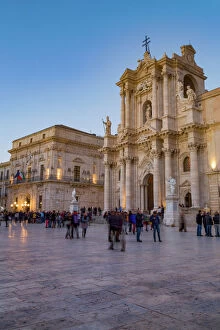 People enjoying passeggiata in Piazza Duomo on the tiny island of Ortygia, UNESCO