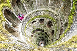 Step Gallery: Photographer at the top of the spiral stairs inside the towers of Initiation Well