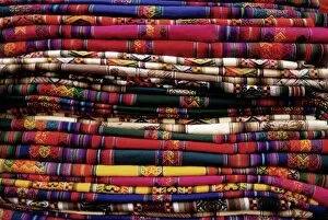 Multi Color Collection: Detail of a pile of colourful ponchos
