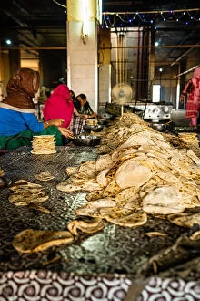 Tourist Attractions Gallery: A pile of fresh roti being sorted at the Golden Temple, Amritsar, Punjab, India, Asia