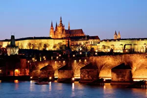 Defence Collection: Prague Castle on the skyline and the Charles Bridge over the River Vltava