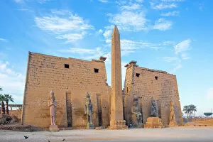 Tourist Attractions Collection: The Pylon of Ramesses ll with the Eastern Obelisk and the Two Colossi of the King seated on his