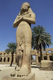 Egypt Collection: Ramses II and daughter Bant Anta, in forecourt of the temple of Karnak