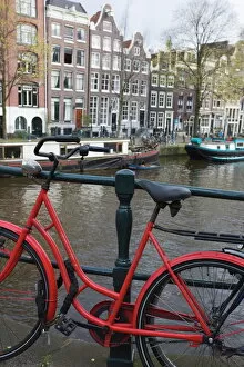 Railing Collection: Red bicycle by the Herengracht canal, Amsterdam, Netherlands, Europe