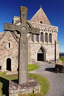 Abbey Collection: Replica of St. Johns cross stands proudly in front of Iona Abbey, Isle of Iona