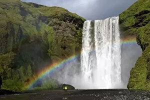 Skogafoss waterfall with rainbow in summer sunshine, South coast, Iceland, Polar Regions