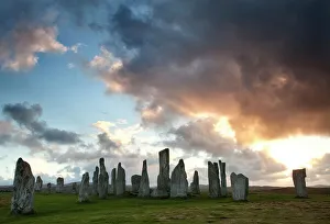 Standing Stones of Callanish at sunset with dramatic sky in the background, near Carloway Standing Stones of Callanish at sunset with dramatic sky in the background, near Carloway
