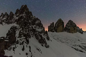 South Tyrol Collection: Starry night over Tre Cime di Lavaredo (Lavaredo peaks) and Paterno mountain, winter view