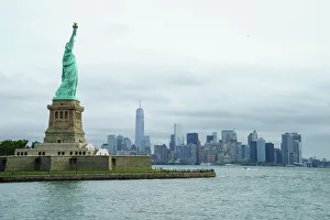 Female Likeness Gallery: Statue of Liberty with the Lower Manhattan skyline and One World Trade Center beyond