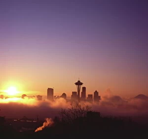 Sun Rise Gallery: Sunrise over silhouette of Seattle skyline and Mt. Rainier, Seattle, Washington