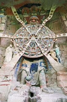 Decorative Collection: Tibetan Buddhist wheel of life rock sculpture at Dazu Rock Carvings, UNESCO World Heritage Site