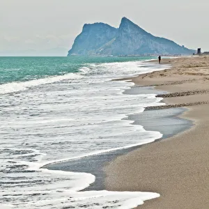 Getting Away From It All Gallery: Tourist walking toward Gibraltar, Alcaidesa beach, near Sotogrande, Andalucia, Spain, Europe