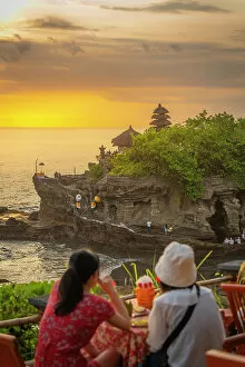 Tourist Attractions Collection: Tourists at Tanah Lot, traditional Balinese temple at sunset, Beraban, Kediri, Tabanan Regency