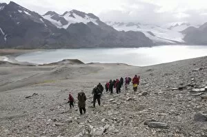 Jointly Gallery: Tourists walk from Fortuna Bay, South Georgia, South Atlantic