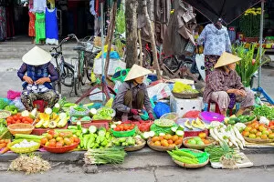 Four People Gallery: Women selling vegetables at the central market in Hoi An, Quang Nam Province, Vietnam