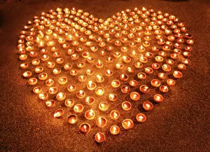 Flame Collection: Love heart shape made out of burning candles and light