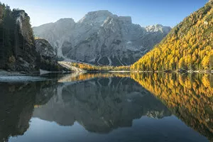 Tourist Attractions Collection: The Braies lake (Pragser Wildsee) during a peaceful autumn morning with mountains