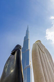Tourist Attractions Collection: Burj Khalifa and the Arabic Couple Statue (Together by Lufti Romein), Dubai