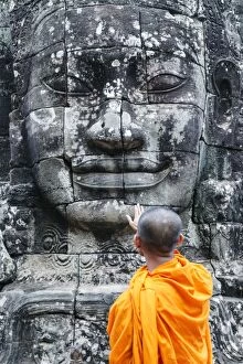 Sculptures Collection: Cambodia, Siem Reap, Angkor Wat complex. Monks inside Bayon temple (MR)