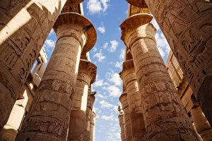 Columns and blue sky at Great hypostyle hall in the Precinct of Amun Re - Karnak Temple