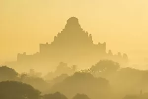 Tourist Attractions Gallery: Dhammayan Gyi Temple at misty sunrise, Bagan, Mandalay District, Mandalay Region, Myanmar