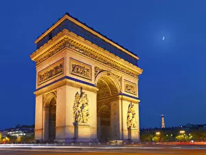 Triumphal Arch Collection: France, Paris, Arc de Triomphe and Eiffel Tower illuminated at night