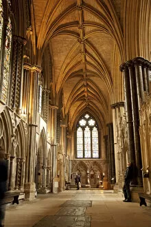 Lincoln, England. A visitor gazes at the medieval stone work in Lincoln cathedral