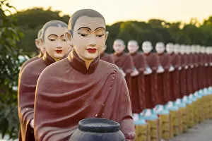 Pagoda Collection: Monk statues at Myo Yar Pyae Pagoda at sunset, Monywa, Monywa Township, Monywa District