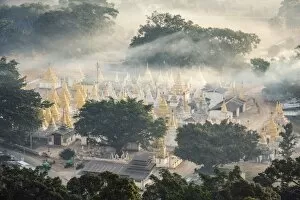 Pagoda Collection: Myanmar, Shan state, Pindaya. Nget Pyaw Taw Pagoda at sunrise, elevated view