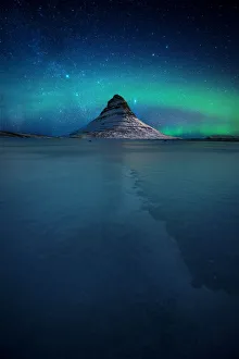 Northern lights over the Kirkjufell mountain in winter, Snaefellsnes Peninsula, Iceland Northern lights over the Kirkjufell mountain in winter, Snaefellsnes Peninsula, Iceland