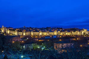 Panoramic night view of the medieval city walls illuminated, Avila, Castile and LeAA³n