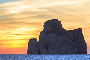 The sunset is reflected on the Beach of Masua, Iglesias