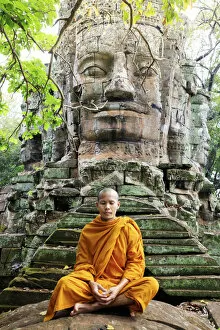 Temples Collection: Southeast Asia, Cambodia, Siem Reap, Angkor temples, Buddhist monk in saffron robes meditating