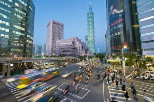 Taiwanese Collection: Taiwan, Taipei, traffic in front of Taipei 101 at a busy downtown intersection in