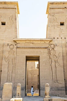 Nubia Collection: Tourist walking throuhg the Temple of Philae on an island in Lake Nasser, Nile River