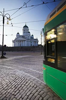 Tram passing in front of Lutheran Cathedral in Senate Square, Helsinki, Finland