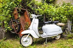 Design Collection: Two-seater Lambretta Innocenti scooter in a courtyard, Morbegno, province of Sondrio