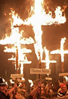 Fire Collection: Burning crosses at the annual bonfire night parade held in Lewes, East Sussex