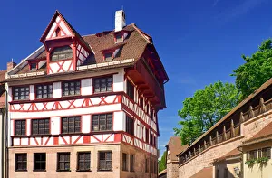 Germany, Bavaria, Nuremberg, Albrecht Durer Haus, Home of the German Renaissance artist with city ramparts behind Germany, Bavaria, Nuremberg, Albrecht Durer Haus, Home of the German Renaissance artist with city ramparts behind