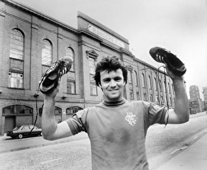 <b class=qtipBold><figcaption>Scottish Soccer - Rangers</figcaption></b><br>Rangers' Davie Cooper holds up his boots outside Ibrox<br><em>© Rangers FC - All Rights Reserved</em> Scottish Soccer - Rangers
