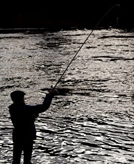 Leisure Time Collection: An angler casts his line on the opening day of the salmon fishing season on the River Tay