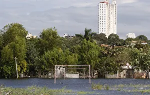 Goalposts stand in a soccer field flooded by the waters of the Paraguay River in Asuncion Goalposts stand in a soccer field flooded by the waters of the Paraguay River in Asuncion