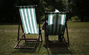 Leisure Time Collection: A man sits in a deck chair on a sunny day in St. James Park in London, Britain