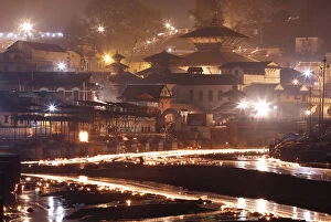 Oil Lamp Collection: Oil lamps illuminate the Bagmati River in the Pashupatinath Temple