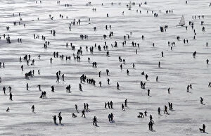 Leisure Time Collection: People enjoy a sunny winter afternoon on the frozen Lac de Joux in Le Pont