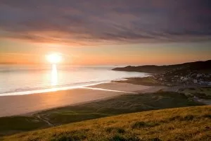 Woolacombe Collection: View of coastline and seaside resort at sunset, viewed from Potters Hill, Woolacombe Beach
