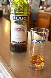 Cafe Collection: A bottle of Ricard 45 pastis and a glass on a zinc bar in a cafe bar in Paris Pastis