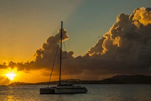 Us Virgin Islands Gallery: Caribbean, USA Virgin Islands. Sailboat moored in Frank Bay at sunset. Credit as